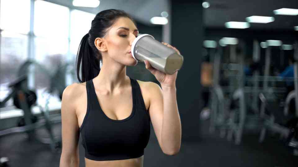 Drinking a protein shake in the gym